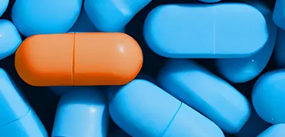 orange pill surrounded by blue pills cover page image SRS brochure
