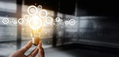 Ideas Portal - hand holding a lightbulb