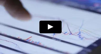 Finger pointing at analytics charts