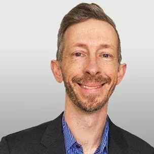 Brent M. headshot image over a grey background