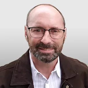 Mark G. headshot image over a grey background