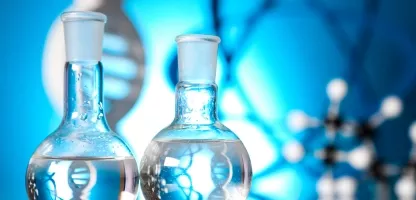 An abstract image of science equipment in front of an illuminated blue background