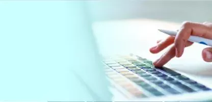 blue left side, womans hand typing on laptop right side