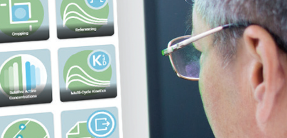 Signals One data processing SPR data sheet header image, scientist looking at monitor screen