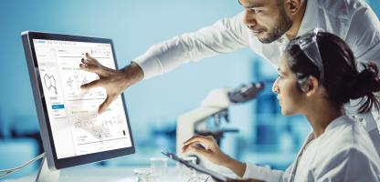 Scientists Analyzing Screen